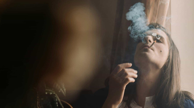 Woman smoking a joint.