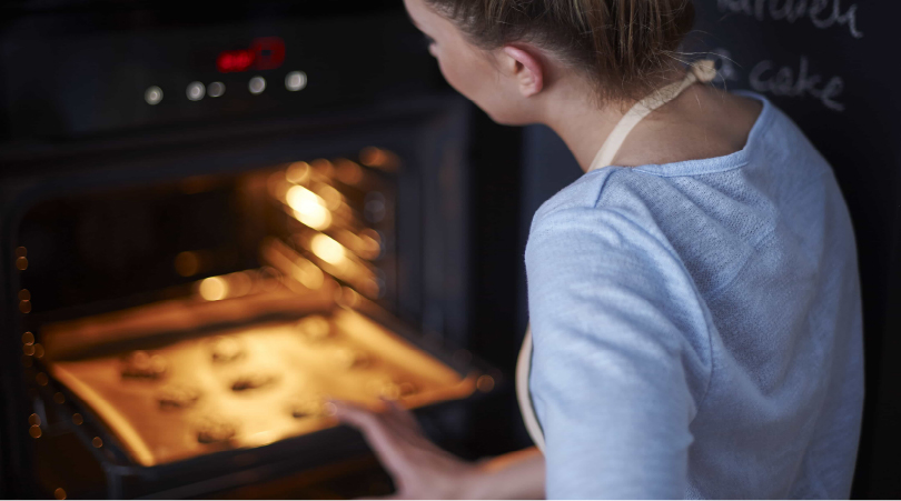 Woman decarboxylating THCa in oven.